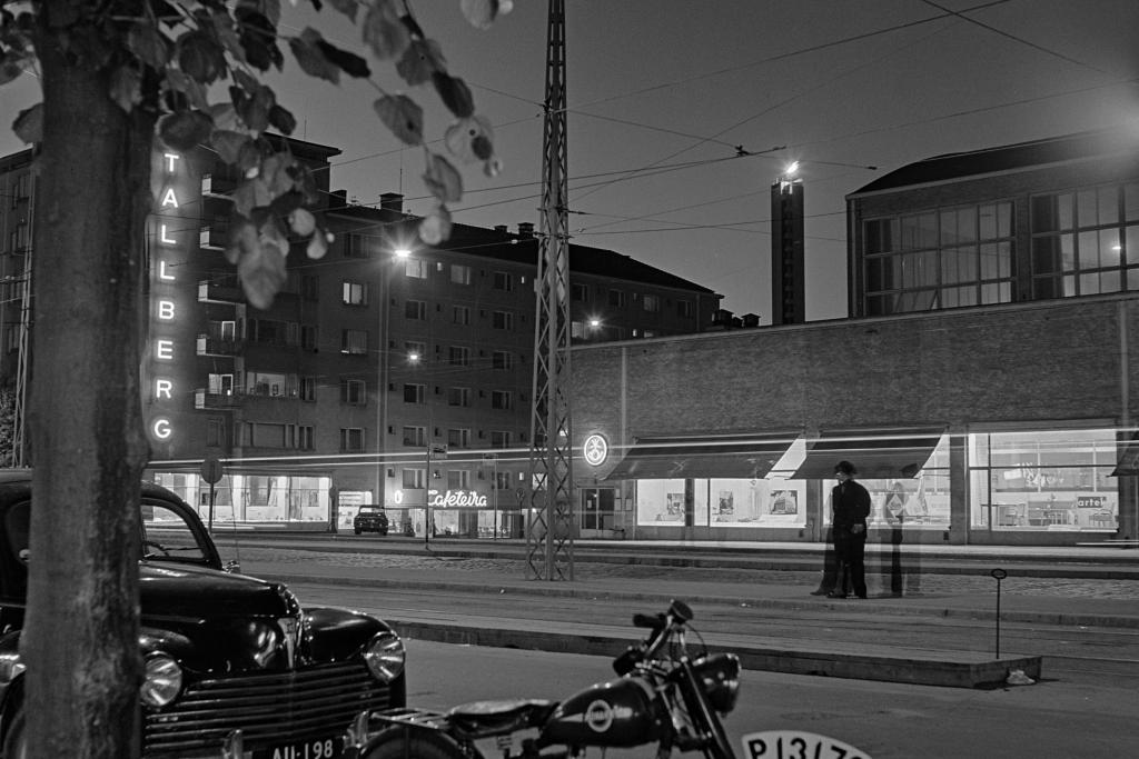 The Olympic flame shines at night in the stadium tower, as seen from the direction of Mannerheimintie. Photograph: Börje Dilén / Helsinki City Museum  Photo: Börje Dilén / Helsingin kaupunginmuseo