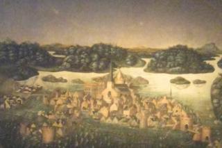 Kuva taulusta, jossa näkyy Tukholman kaupunki 1500-luvulla sekä yläpuolella haloilmiö eli valokehä