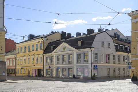 Foto av en ljusblå byggnad i nyklassisk stil