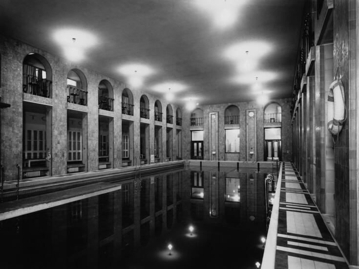 The large pool at Yrjönkatu swimming hall, with a life buoy in the foreground.